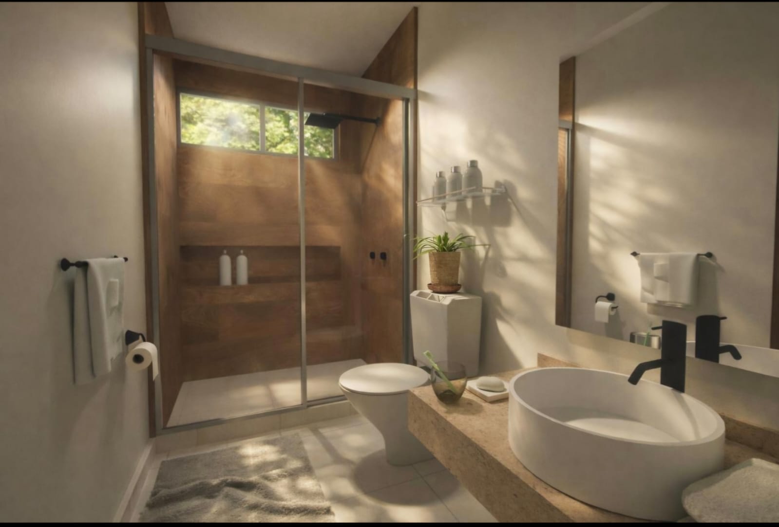 Baño con regadera de cristal en casa Aram Residencial